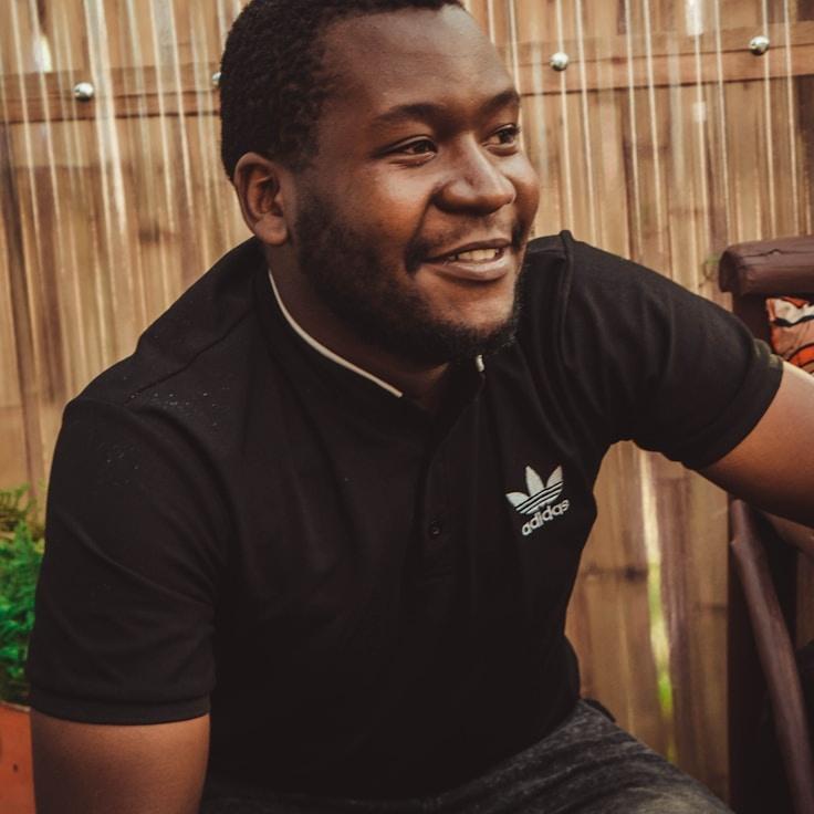 Kaveri Mehta, Lead Design Curator at HarborLoomWorks, reviewing corporate floral arrangements